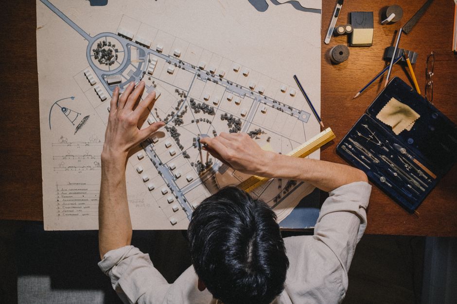 Professionals reviewing financial graphs and charts during a meeting.